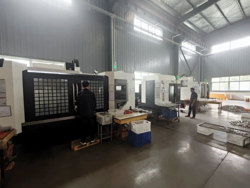 CNC multi-axis punching machine creating uniform slotted patterns on strut channel