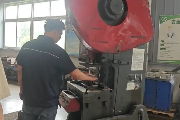 Metal punching process in a manufacturing facility